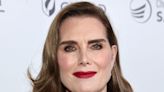 Brooke Shields Looks Ravishing in Red for Provocative Art Event