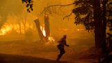 Northern California wildfire spreads, with more hot weather expected. Thousands evacuate