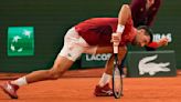 Defending champion Novak Djokovic sets Grand Slam match wins record, but suggests he may need to withdraw from French Open - The Boston Globe