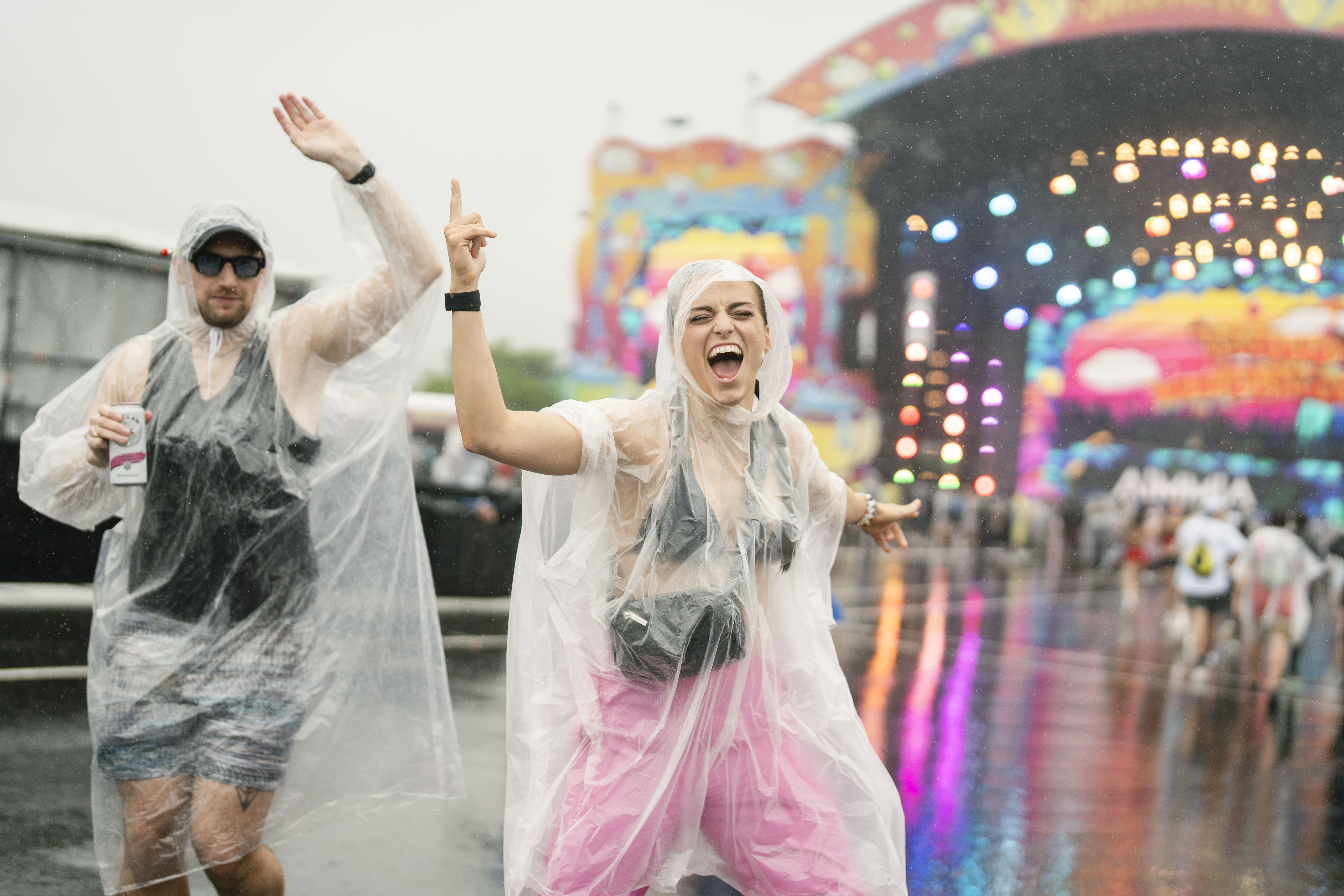 Fans dancing in the rain at Beyond Wonderland music festival