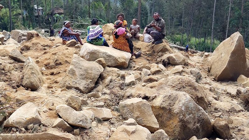 As many as 2,000 people feared buried under Papua New Guinea landslide as survivors dig with hands and spades