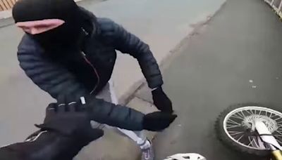 Helmet cam footage shows thugs 'bike jack' motorcyclist after daylight ambush