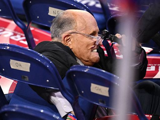 Rudy Giuliani Crashes Into Empty Chairs After Bizarre Fall At RNC