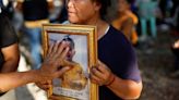 Prayers, sorrow at temples as Thailand mourns children slain in massacre