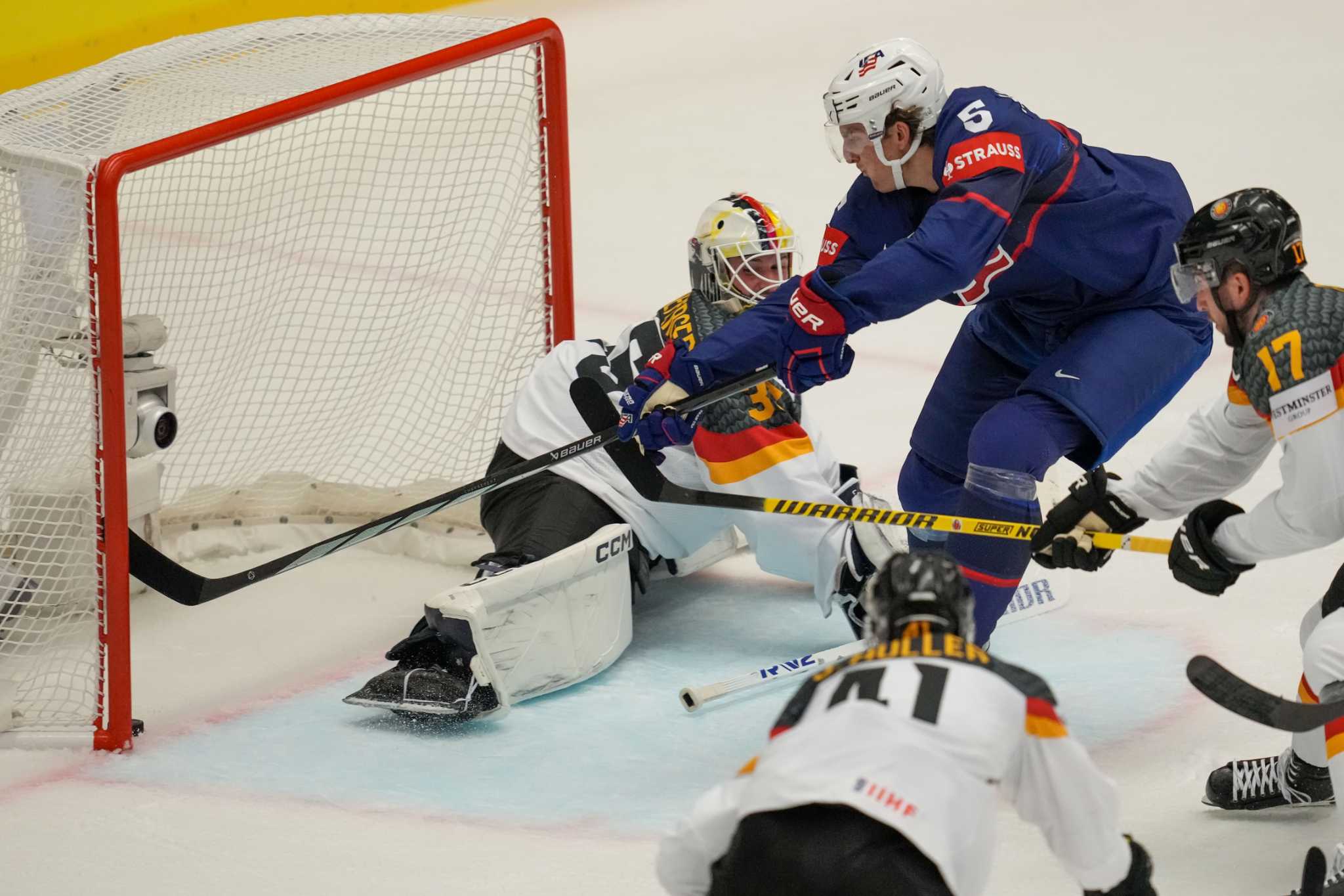 US routs Germany and Bedard scores twice as Canada wins opener at ice hockey worlds