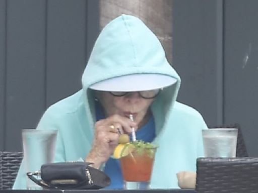 Shirley MacLaine, 90, enjoys a Bloody Mary cocktail