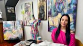 Artist’s hand-painted dress to match her work goes viral