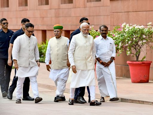 Newly confident opposition stages walkout as Modi address India’s new parliament