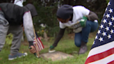 High School students clean historic headstones for Black Veterans