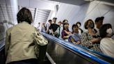 Japanese city bans walking on escalators