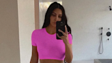 Kim Kardashian looks unbelievable on Instagram in matching SKIMS neon pink crop top and pants