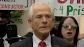 Peter Navarro's Post-Conviction Press Conference Crashed By Sign-Wielding Nemesis