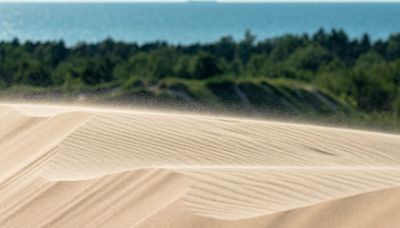 Boy, 12, is rescued by bystanders after being buried in 5ft deep hole in sand dune for 14 minutes