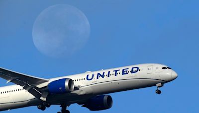 United Airlines reports $124 million loss in a quarter marred by grounding of some Boeing planes