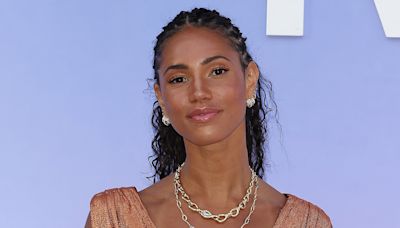 Vick Hope is radiant in a copper metallic plunging dress