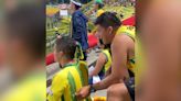 Watch this soccer fan's unique way of helping a friend who is blind follow a game