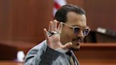 Johnny Depp settles case with film location manager who accused the actor of punching him in the ribs and firing him for refusing to stay silent