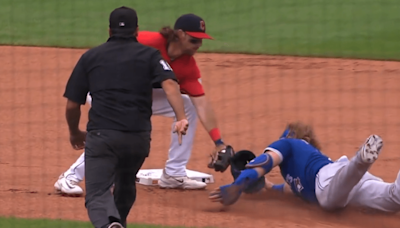 MLB fans were confused after Justin Turner was ruled safe because his helmet blocked the Guardians' tag