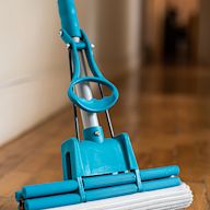A mop with a sponge head that is used for cleaning floors Usually comes with a wringer to remove excess water from the sponge Effective in cleaning spills and stains on hard floors