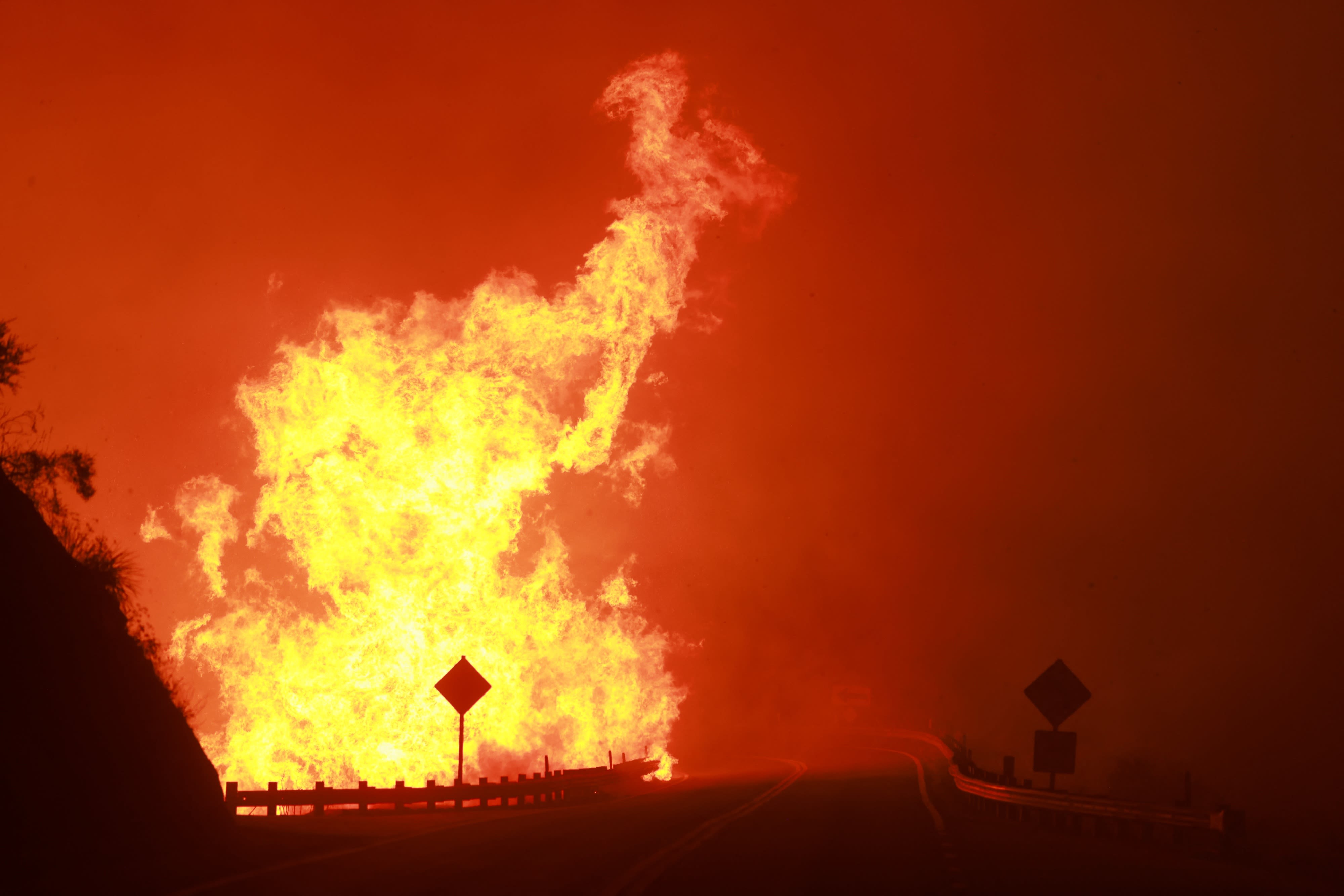 Southern California fire explodes in size, forcing mountain town to evacuate