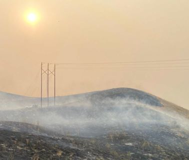 A man is accused of pushing a burning car into a gully, causing a California wildfire that’s spread to over 145,000 acres