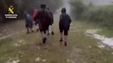 Moment police rescue children from raging storm at camp site in northern Spain