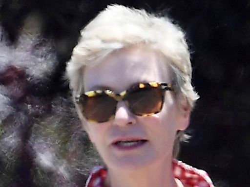 Jane Lynch sports patriotic colors with a cute pup on Fourth of July