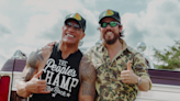 Watch Chris Jason Team Up With Dwayne 'The Rock' Johnson In Video Bringing 'Rowdy' Anthem To Life | iHeartCountry Radio