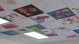 Third grade students paint ceiling tiles to decorate Oshkosh fire station