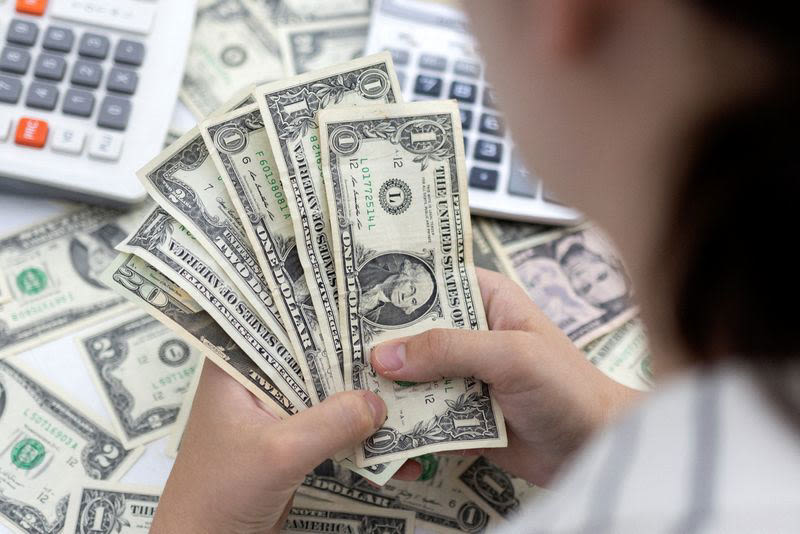 Dollar holds its ground as key inflation data looms