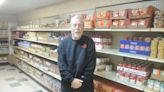 Paying it back provides a rewarding moment for food pantry volunteer