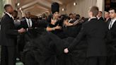 Cardi B's Met Gala Train Is So Long, She Needs Five Assistants to Unravel It