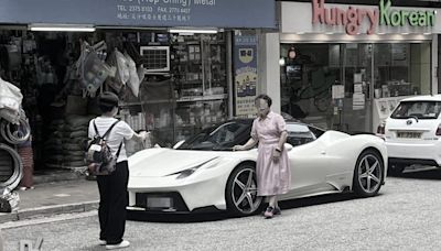 Four middle-aged women surround Ferrari in Tsim Sha Tsui - Dimsum Daily