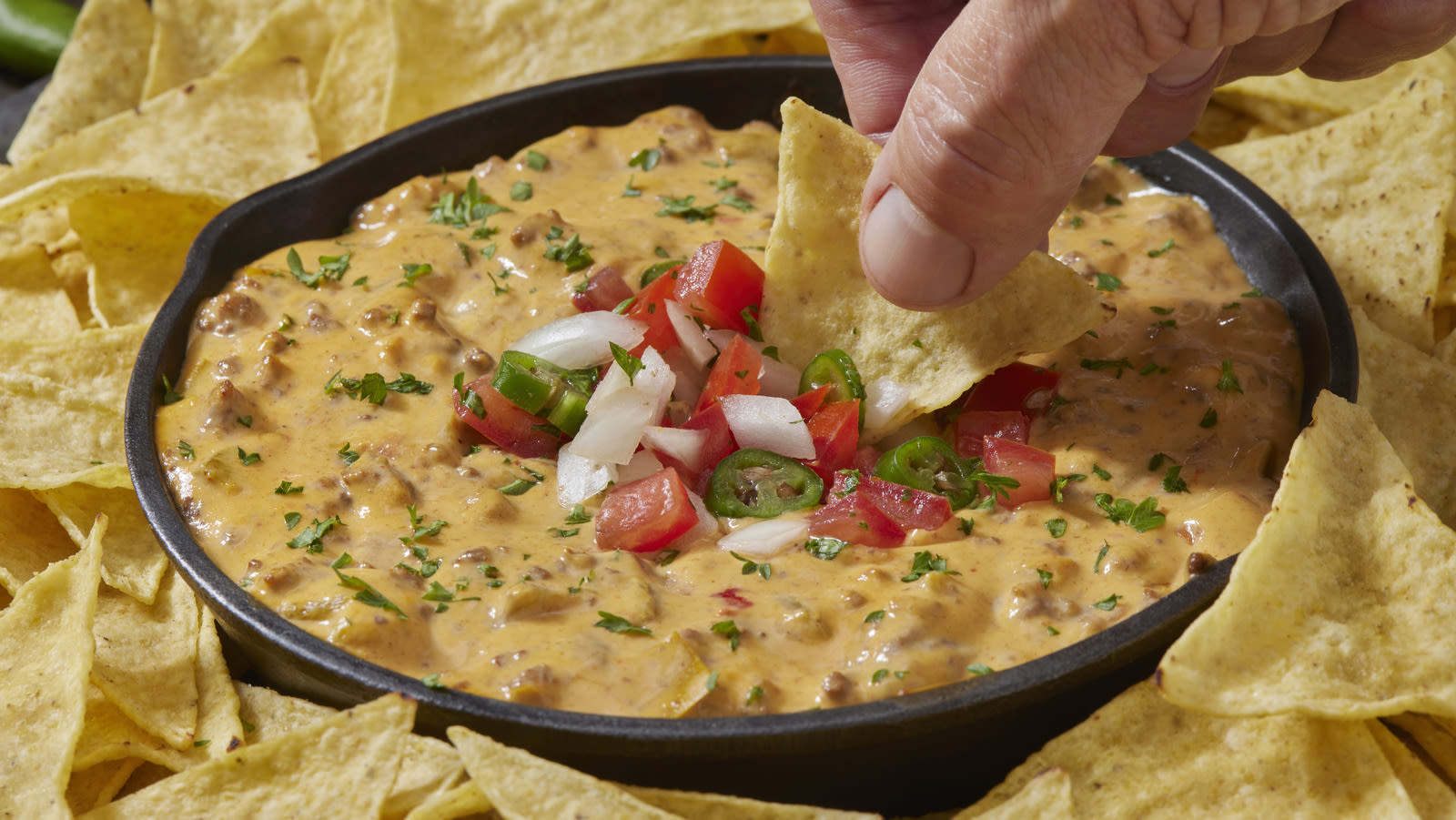 What Are The Best Cheeses To Use For Nacho Sauce? We Asked An Expert