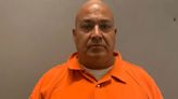 Uvalde school police chief pictured in orange jumpsuit after being charged over mass shooting which left 21 dead