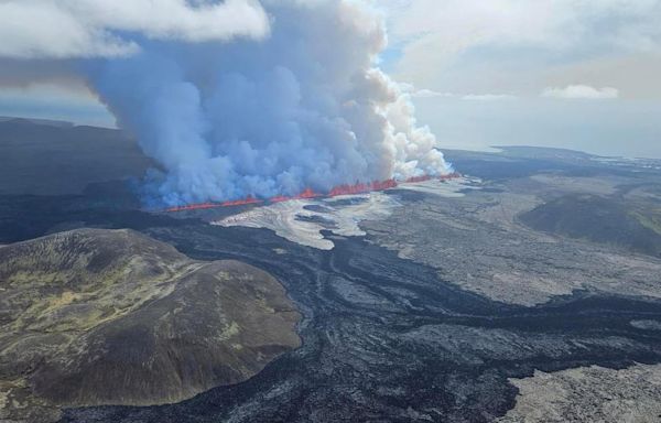 Watch Live: "Explosive" Iceland volcano eruption shoots lava across roads and sends pollution toward the capital