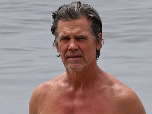 Josh Brolin gets dripping wet as he shows off muscled torso on beach