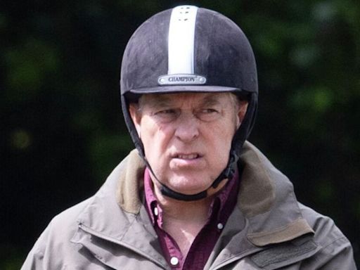 Andrew 'scowls' as he takes solo ride before Trooping the Colour snub