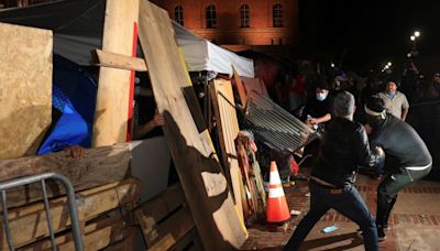 Violence flares at UCLA as police end protests at New York's Columbia