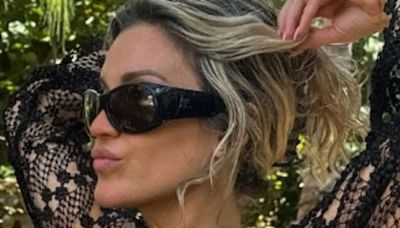 Ashley Roberts flaunts her sensational figure in a skimpy black bikini