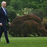 US President Joe Biden walks on the South Lawn of the White House after returning on Marine One, in Washington, DC, on May 6, 2024. Biden is...