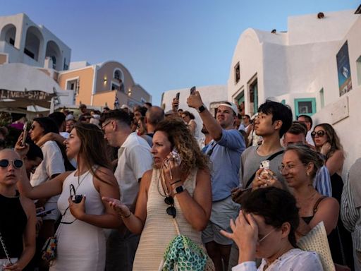 Greece's Santorini bursts with tourists as locals call for a cap