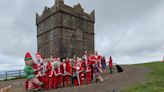 Why a group of 25 Santas climbed up Rivington Pike 6 months before Christmas