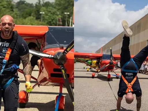 Three Planes Pulled by Man Walking on Two Hands