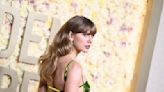 Taylor Swift Holds Court in Shiny Green Dress by Gucci at Golden Globes 2024