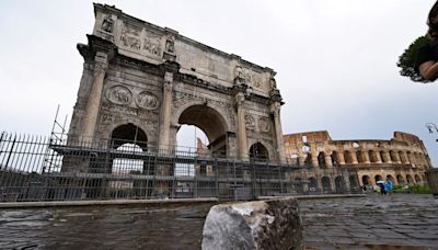 Lightning strike damages 4th century arch near Colosseum as freak storm hits Rome | CNN