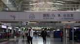 China's easing COVID curbs spark travel inquiry surge, and caution