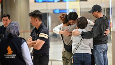 Shaken passengers arrive in Singapore after deadly turbulence-hit flight