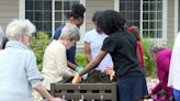 Students from Rolling Acres Middle School plant with Alzheimer residents