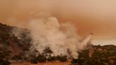 Torrid heat bakes millions of people in large swaths of US, setting records and fanning wildfires